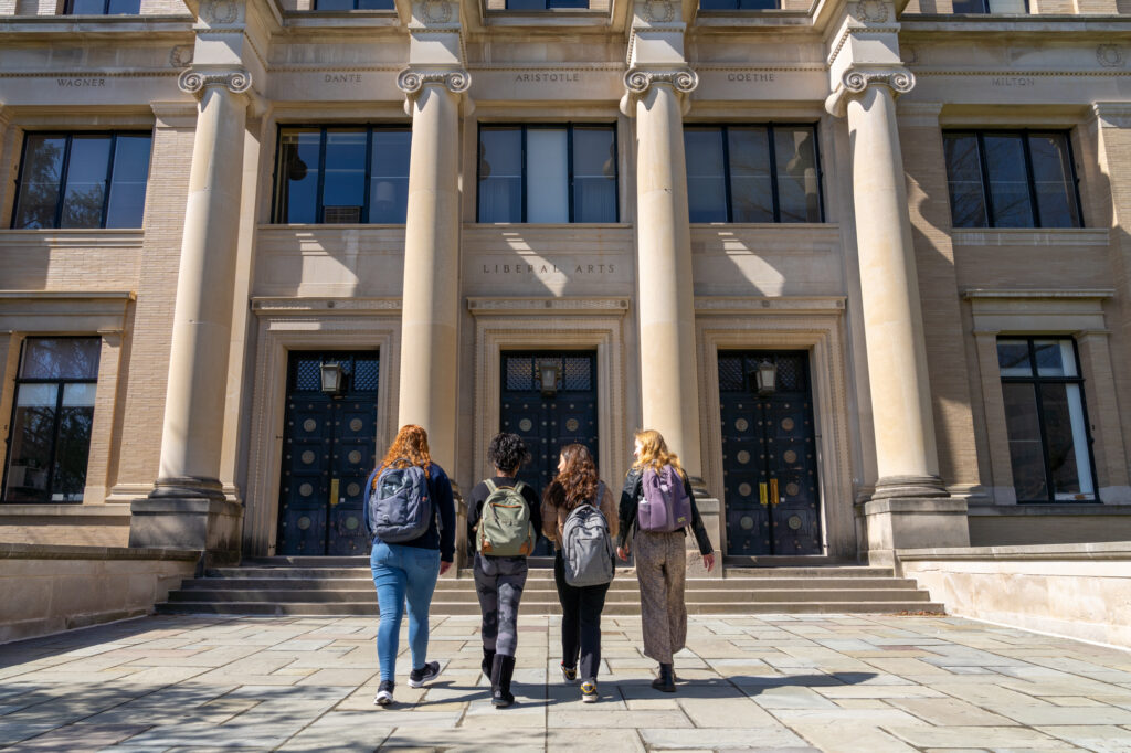 Students walking outside of the sparks building on campus